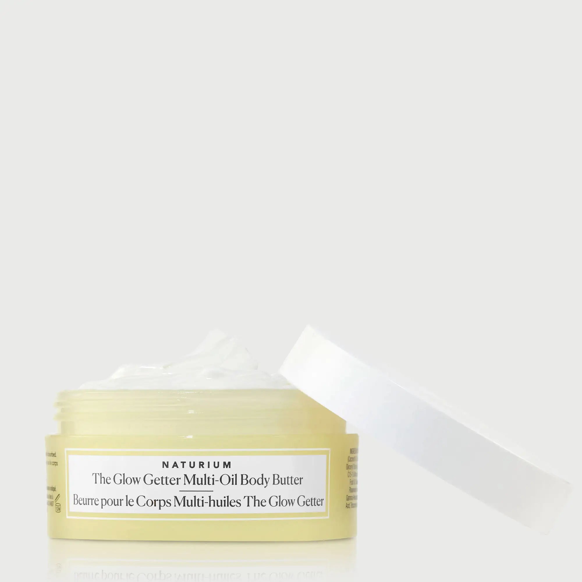 the-glow-getter-multi-oil-body-butter-travel-size-f1 NATR-40115_Glow-Getter-Body-Butter-Mini_front_capoff_bonebkgd.webp