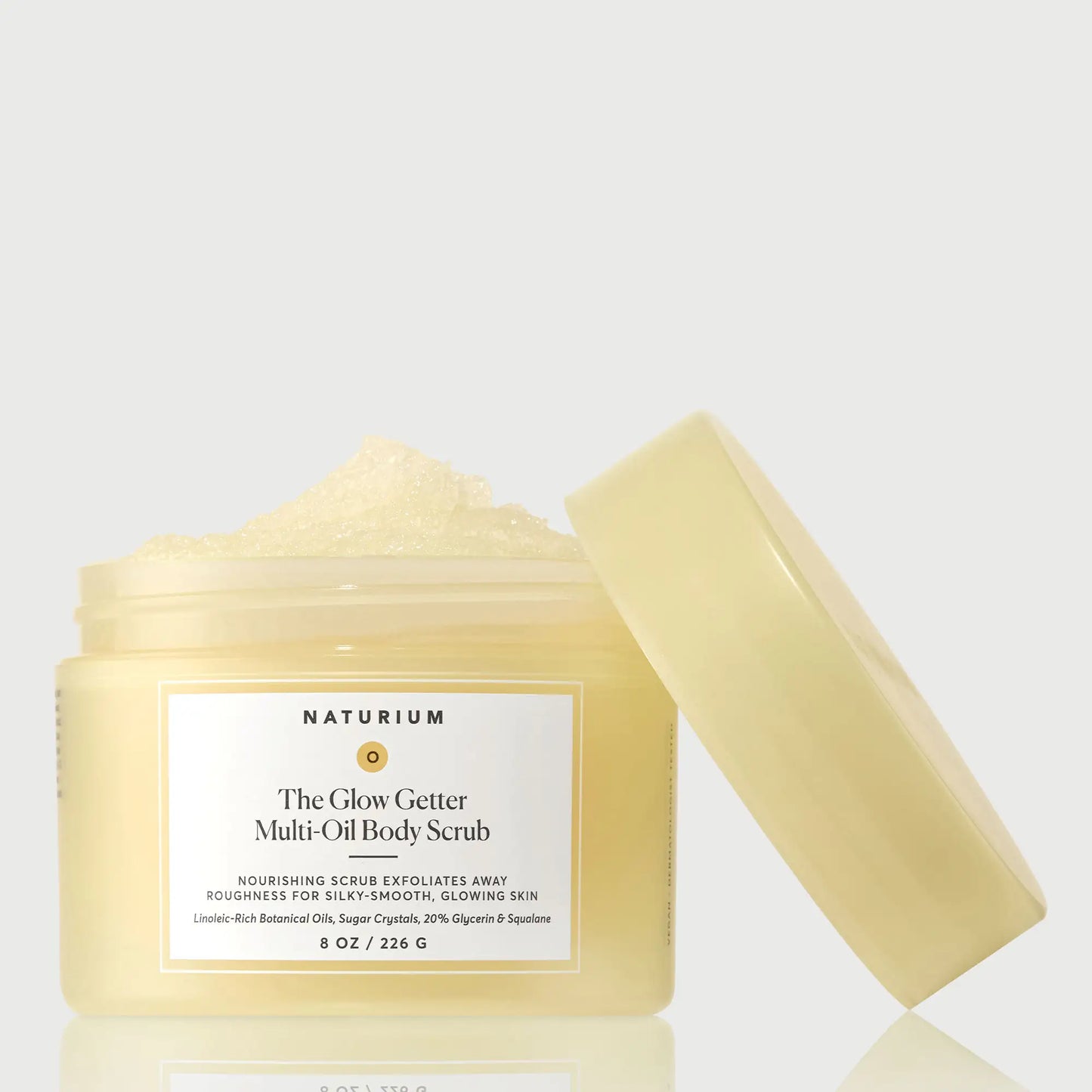 the-glow-getter-multi-oil-body-scrub-w9 NATR-40028-GlowGetter-Multi-Oil-Body-Scrub-Front-CapOff-bonebkgd.webp