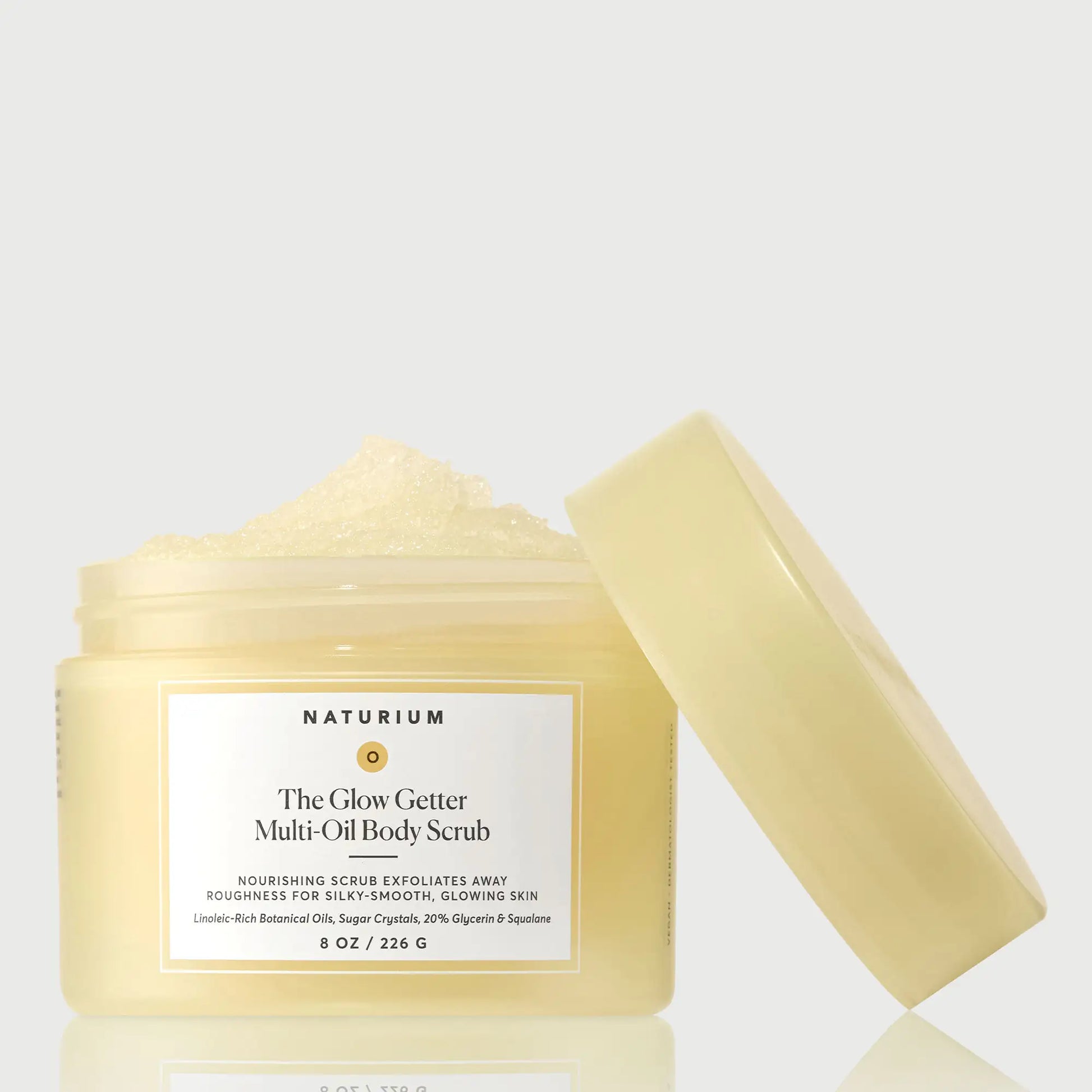 the-glow-getter-multi-oil-body-scrub-w9 NATR-40028-GlowGetter-Multi-Oil-Body-Scrub-Front-CapOff-bonebkgd.webp